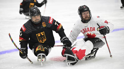 Adam Dixon sled hockey game action