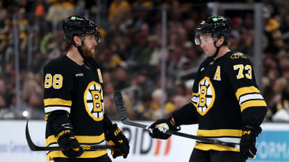 David Pastrnak #88 of the Boston Bruins talks with Charlie McAvoy #73 during the third period of the game against the Florida Panthers at TD Garden on October 21, 2025 in Boston, Massachusetts. The Panthers defeat the Bruins 4-3. (Photo by Maddie Meyer/Getty Images)