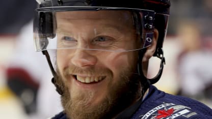 Toby Enstrom #39 of the Winnipeg Jets is all smiles during the pre-game warm up prior to NHL action against the Colorado Avalanche at the Bell MTS Place on February 3, 2018 in Winnipeg, Manitoba, Canada. (Photo by Darcy Finley/NHLI via Getty Images)