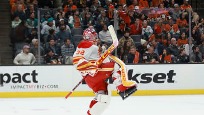 Dustin Wolf #32 of the Calgary Flames celebrates the 3-2 overtime victory over the Anaheim Ducks after the game at Honda Center on January 07, 2025 in Anaheim, California. (Photo by Nicole Vasquez /NHLI for Getty Images )