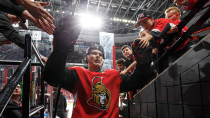 Brady Tkachuk #7 of the Ottawa Senators high-fives fans as he leaves the ice after warmup prior to a game against the Boston Bruins at Canadian Tire Centre on November 27, 2019 in Ottawa, Ontario, Canada. (Photo by Andre Ringuette/NHLI via Getty Images)