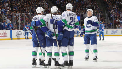 Boeser seals hat trick with empty-netter