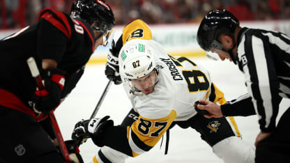 Sidney Crosby #87 of the Pittsburgh Penguins and Sebastian Aho #20 of the Carolina Hurricanes face off during the third period of the game at Lenovo Center on January 05, 2025 in Raleigh, North Carolina. (Photo by Jared C. Tilton/Getty Images)