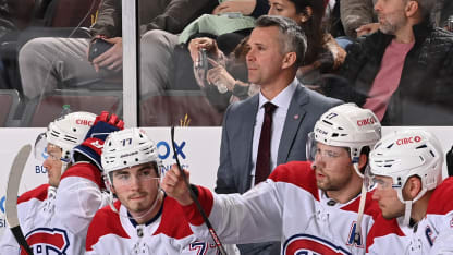 Martin St Louis behind bench