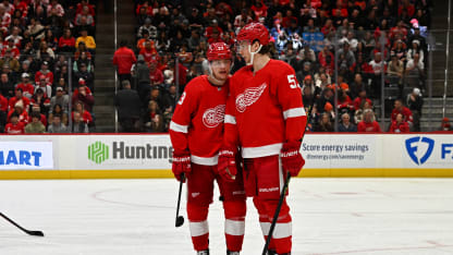 Detroit Red Wings left wing Lucas Raymond (23) and Detroit Red Wings defenseman Moritz Seider (53) talk prior to a faceoff during the game between the Detroit Red Wings and the Edmonton Oilers on Tuesday Febuary 7, 2023 at Little Caesars Arena in Detroit, MI. (Photo by Steven King/Icon Sportswire via Getty Images)