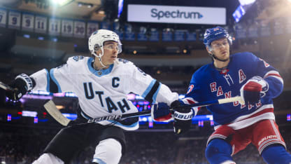 Clayton Keller #9 of the Utah Hockey Club skates against Adam Fox #23 the New York Rangers