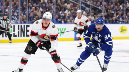 Tim Stützle #18 of the Ottawa Senators skates with the puck against Auston Matthews #34 of the Toronto Maple Leafs during the first period of Game One of the First Round of the 2025 Stanley Cup Playoffs at Scotiabank Arena on April 20, 2025 in Toronto, Ontario, Canada. (Photo by Michael Chisholm/NHLI via Getty Images)