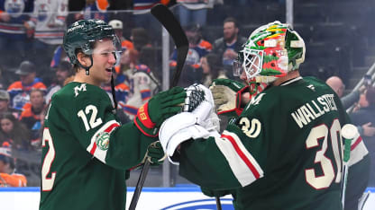 Matt Boldy #12 and Jesper Wallstedt #30 of the Minnesota Wild celebrate a victory over the Edmonton Oilers after the game at Rogers Place on January 31, 2026, in Edmonton, Alberta, Canada. (Photo by Andy Devlin/NHLI via Getty Images)