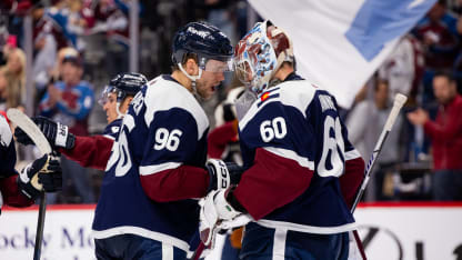 Mikko Rantanen #96 hugs Justus Annunen #60 of the Colorado Avalanche after the team defeated the Nashville Predators 7 at Ball Arena on March 30, 2024 in Denver, Colorado. (Photo by Ashley Potts/NHLI via Getty Images)