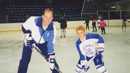 Tom Chmielewski with his dad during youth hockey at Air Forc