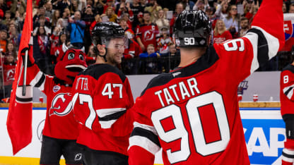 Paul Cotter #47 and Tomas Tatar #90 of the New Jersey Devils