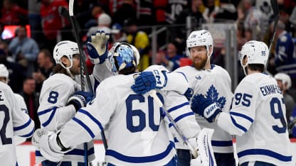 Maple Leafs defenseman Christopher Tanev (8), defenseman Jani Hakanpaa (28), and defenseman Oliver Ekman-Larsson (95) congratulate goalie Joseph Woll (60) after winning in overtime of the Toronto Maple Leafs versus Washington Capitals National Hockey League game on November 13, 2024 at Capital One Arena in Washington, D.C.. (Photo by Randy Litzinger/Icon Sportswire via Getty Images)