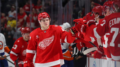 Axel Sandin-Pellikka #44 of the Detroit Red Wings celebrates his third period goal with teammates while playing the New York Islanders at Little Caesars Arena on December 16, 2025 in Detroit, Michigan. (Photo by Gregory Shamus/Getty Images)