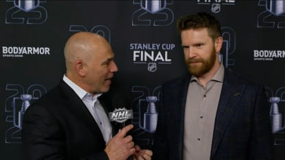 Billy Jaffe talks with Brett Kulak before Game 5