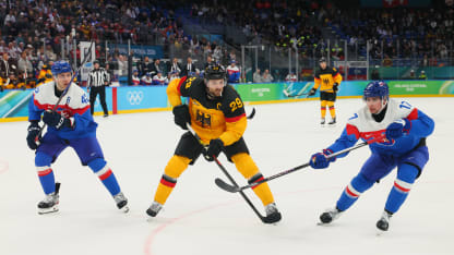 Leon Draisaitl #29 of Team Germany controls the puck against Simon Nemec #17 and Martin Fehervary #42 of Team Slovakia in the second period during the Men's Quarterfinals Playoff match between Slovakia and Germany on day 12 of the Milano Cortina 2026 Winter Olympic games at Milano Santagiulia Ice Hockey Arena on February 18, 2026 in Milan, Italy. (Photo by Bruce Bennett/Getty Images)