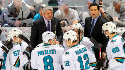 WINNIPEG, CANADA - JANUARY 5: Head Coach Todd McLellan of the San Jose Sharks (back left) instructs his players during a third period stoppage in play against the Winnipeg Jets on January 5, 2015 at the MTS Centre in Winnipeg, Manitoba, Canada. The Sharks defeated the Jets 3-2. (Photo by Jonathan Kozub/NHLI via Getty Images)