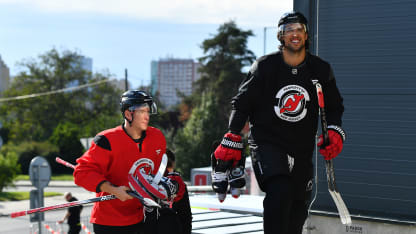 Ondrej Palat #18 and Brenden Dillon #5 of the New Jersey Devils