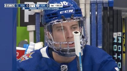 Mitch Marner struggles to get mouth guard out of helmet