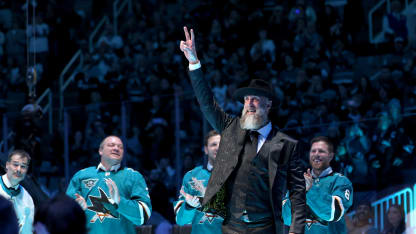 Joe Thornton, on stage with former teammates Patrick Marleau, Douglas Murray, Ryane Clowe and Joe Pavelski, waves to the crowd at a ceremony honoring him and retiring his #19 jersey before the San Jose Sharks game against the Buffalo Sabres at SAP Center on November 23, 2024 in San Jose, California. (Photo by Ezra Shaw/Getty Images)