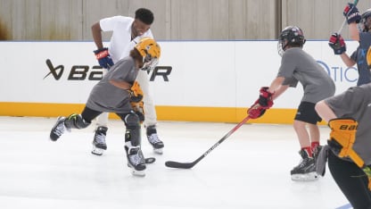 Duclair with kids on synthetic ice rink