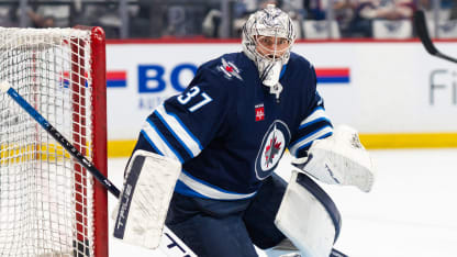 Hellebuyck with an incredible stick save