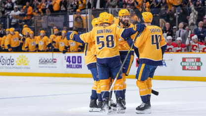NASHVILLE, TENNESSEE - NOVEMBER 1: Nicolas Hague #41 celebrates a goal by Michael Bunting #58 with Fedor Svechkov #40 of the Nashville Predators against the Calgary Flames during an NHL game at Bridgestone Arena on November 1, 2025 in Nashville, Tennessee. (Photo by John Russell/NHLI via Getty Images)