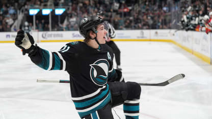 Celebrini spins around to score