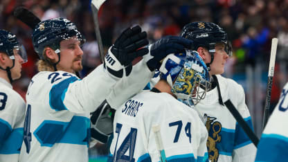 Juuse Saros #74 of Team Finland is consoled by his teammates after the team's 2-3 defeat in the Men's Semifinals Playoff match between Canada and Finland on day fourteen of the Milano Cortina 2026 Winter Olympic games at Milano Santagiulia Ice Hockey Arena on February 20, 2026 in Milan, Italy. (Photo by Elsa/Getty Images)