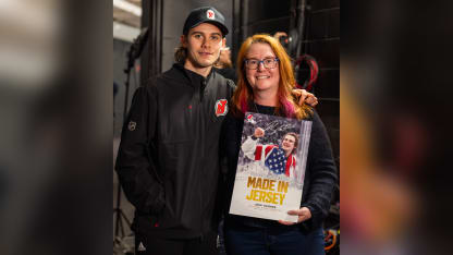 Jack Hughes meets photographer of iconic Olympic photo