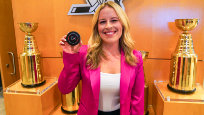 Crechiolo with game puck from her milestone night in Philadelphia.