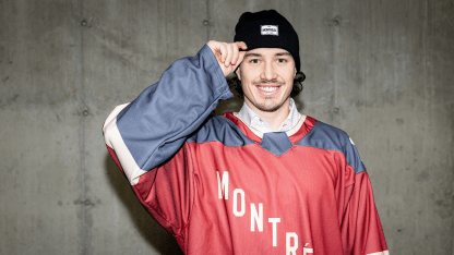 Canadiens players pose in PWHL Montreal jerseys