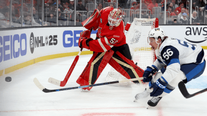 Binnington_Canada_4N_plays-puck