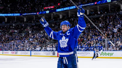 Toronto Maple Leafs players celebrating a goal during NHL game action 2026 season