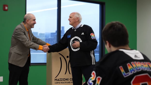 Dan Hilferty and Dacid Weisberg of the Mazzoni Center meet ahead of the Flyers Pride Game