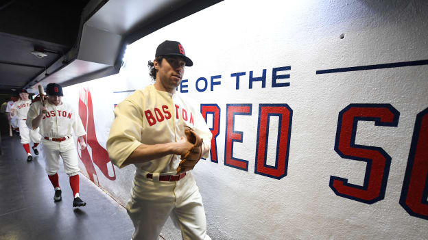 Photos: Bruins Arrive at Fenway in Red Sox Uniforms