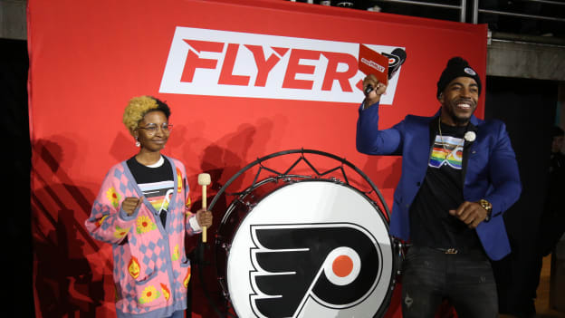 Trin bangs the drum to open the Pride Night game