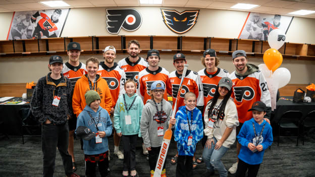 Group shot of the players at the SkateSkin design event.