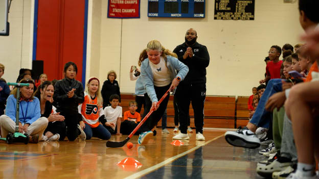 Colonial Elementary students participate in a relay race at Flyers Recess