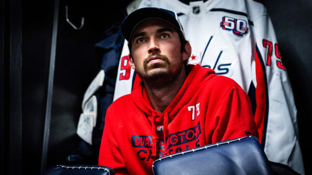 Charlie Lindgren sits in his locker room stall as he prepares to face the Kings on March 13, 2025 in Los Angeles, California.