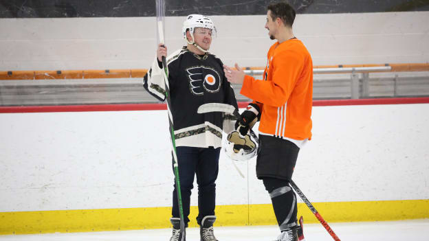 Morgan Frost talks with military member during the team’s annual military skate with the USO