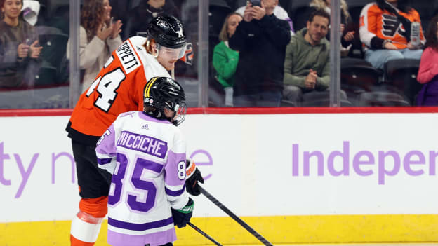 Owen Tippett and Owen Micciche take the ice ahead of warm-ups for the team’s annual Hockey Fights Cancer game.