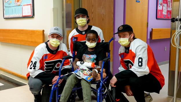 Nick Seeler, Jamie Drysdale, and Cam York visit with patients at St. Christopher's Hospital for Children