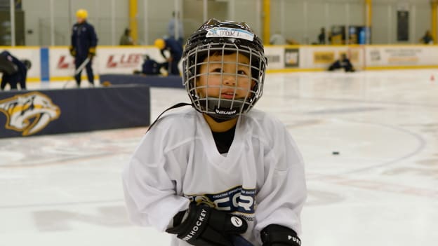 Kid_looking_Into_Camera_On-Ice