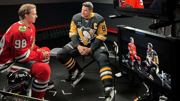 Connor Bedard chatting with Sidney Crosby at PMT