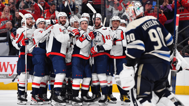 The Washington Capitals share words with goaltender Elvis Merzlikins of the Columbus Blue Jackets following a 3-2 overtime victory in a game at Nationwide Arena on December 21, 2023.