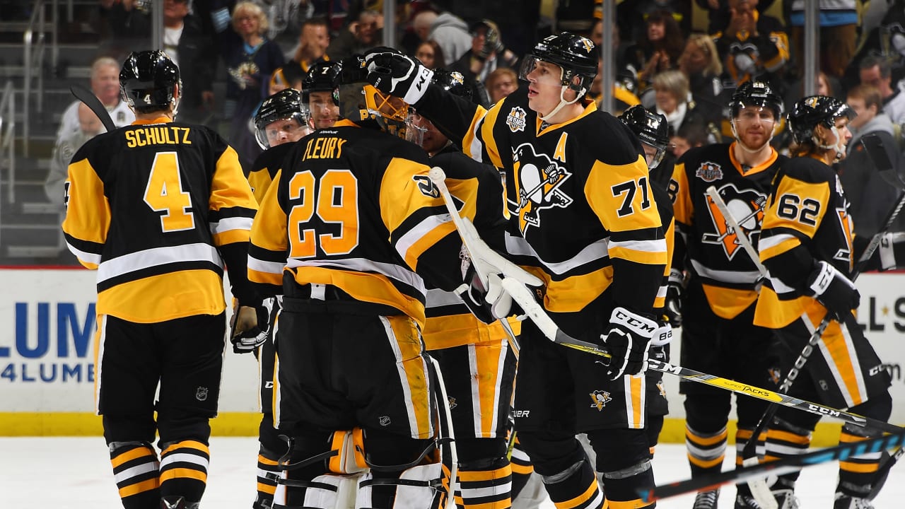 NHL great Mario Lemieux talks to Evgeni Malkin of the Pittsburgh