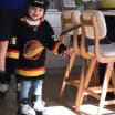 Roussel, three-year-old son, practice skating around in family kitchen