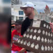 Sam Bennett shows off Conn Smythe Trophy for fans at parade