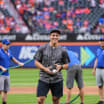 Lee Throws Honorary First Pitch at Mets Game