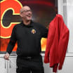 Star wears Calgary flames red blazer player game